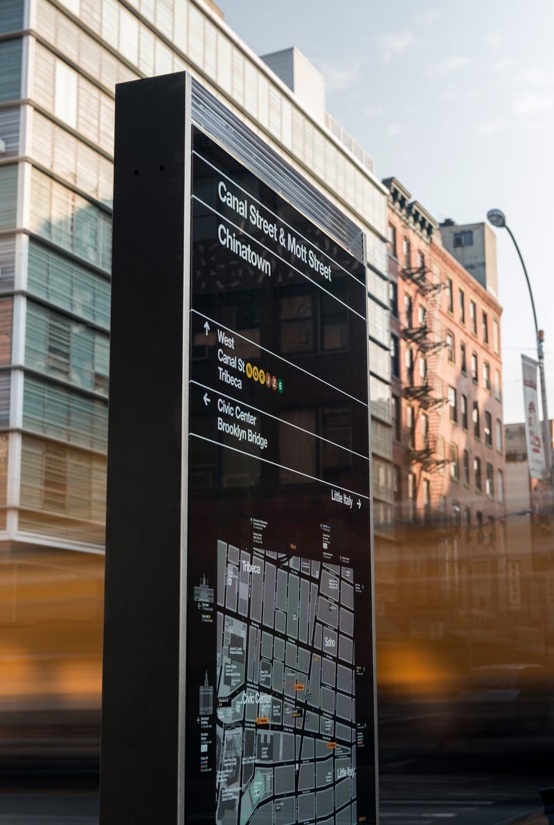 Wayfinding totem with Helvetica for the NYC DOT Walk NYC pedestrian wayfinding program in Manhattan, New York City