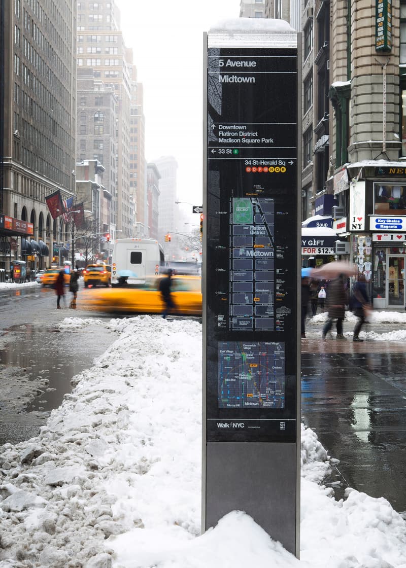 Wayfinding totem with Helvetica for the NYC DOT Walk NYC pedestrian wayfinding program in Manhattan, New York City