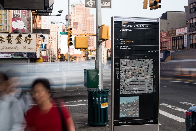 Wayfinding totem with Helvetica for the NYC DOT Walk NYC pedestrian wayfinding program in Manhattan, New York City